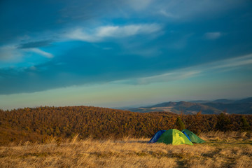 trekking hiking life style travel photography tents in mountains moody scenery landscape natural environment wallpaper view cloudy sky background, empty copy space for your text here
