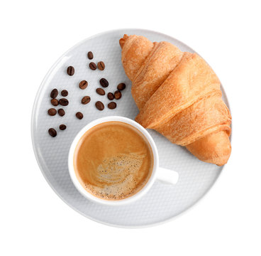 Fresh croissant and coffee on white background, top view
