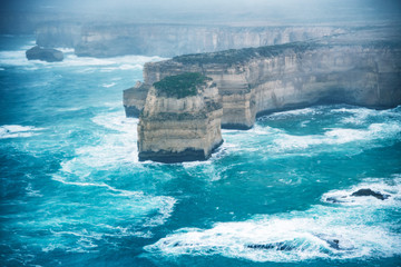 Helicopter aerial view of Great Ocean Road during a storm - Port Campbell, Australia
