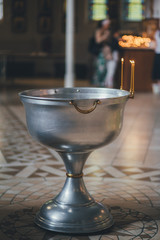 Church ordinance orthodox and wedding, church wedding, religious of a child in church, icons, Orthodox church, candles, interior of the Orthodox Church, bible, font