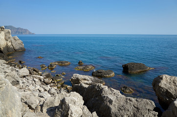 Fototapeta na wymiar The rocky coast of the Black Sea. Cape Alchak in Sudak, Crimea