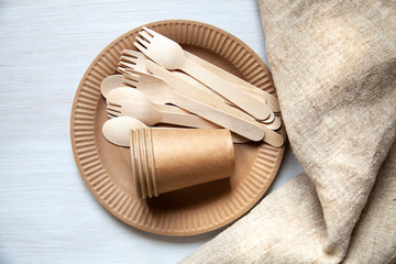 eco paper plate dish fork on old wooden table