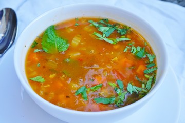 A bowl of hot and sour vegetable soup at an Indian restaurant