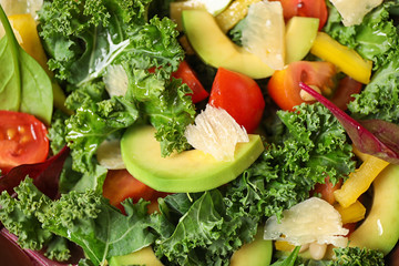 Tasty fresh kale salad as background, closeup