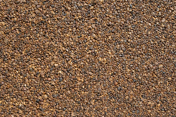 Decorative road surface of small pebbles. Texture