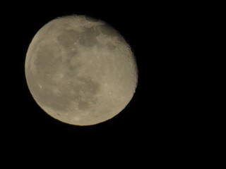 Moon With Clouds In The Night Sky. Concept of a spooky theme and mystery.