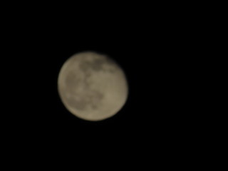 Moon With Clouds In The Night Sky. Concept of a spooky theme and mystery.