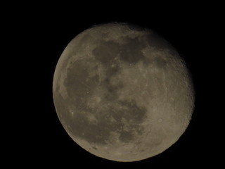 Moon With Clouds In The Night Sky. Concept of a spooky theme and mystery.