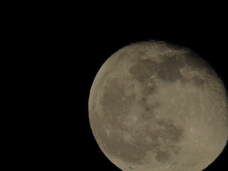 Moon With Clouds In The Night Sky. Concept of a spooky theme and mystery.
