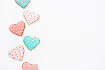 Gingerbread cookies with frosting in the shape of a heart on white background. Valentines day...