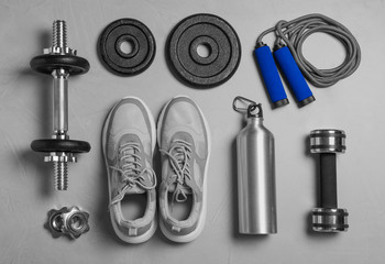 Gym equipment on light grey background, flat lay