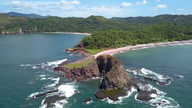 Costa Rica Hidden Beach 4K - Breathtaking Drone Shot flying over Cliff on Coastline with Tropical Jungle Landscape at Exclusive Location- Welcome to Paradise!