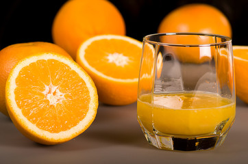 Fresh orange juice. Orange juice in a beautiful glass. Juicy orange.