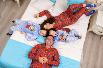 Mom, Dad and Sons Celebrate New Year in Pajamas