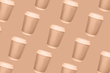 Pattern of coffee cups on a blue background. Flat lay.