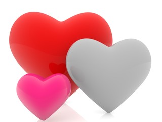Three hearts of different sizes and colors