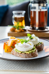 sandwich with avocado and poached eggs