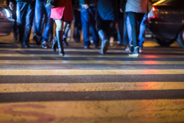 people  walk over pedestrian crossing traffic road