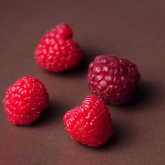 ripe raspberries on a plate, close up
