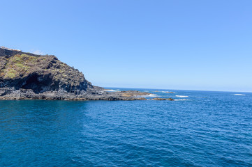 Naklejka premium Bay Formed By Volcanic Rocks In Hell In Garachico. April 14, 2019. Garachico, Santa Cruz De Tenerife Spain Africa. Travel Tourism Street Photography.
