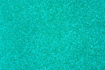 Bright trendy turquoise background with glitter.