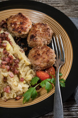 Minced meat cutlets with boiled sauerkraut.