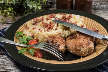 Minced meat cutlets with boiled sauerkraut.