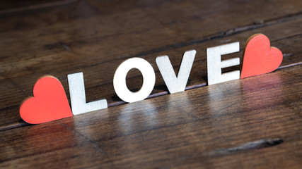 LOVE background panorama banner - Wooden letters standing on rustic brown table