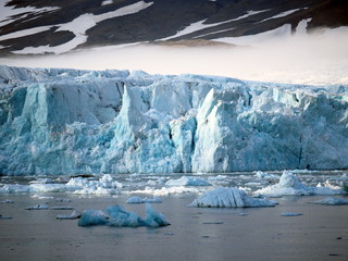 Icebergs against the backdrop of the Hans Glacier.  Europe, Svalbard, Hornsund