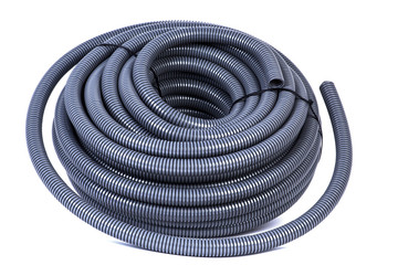 Roll of plastic corrugated pipe for electrical installation isolated on white background