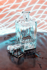 Glass decanter with reflection. Alcohol in a decanter. Play of light. Drawing with light. Alcoholic...