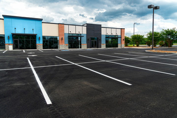 No Customers and Empty Parking Lot at Retail Shopping Center