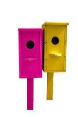 bright pink and yellow birdhouses isolated on a white background