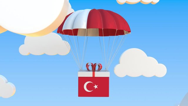 Carton with flag of Turkey falls with a parachute. Loopable conceptual 3D animation