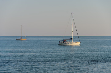 Fototapeta na wymiar Two sailing yachts at sea