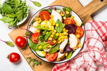 Salad with Chicken and vevetables on white.