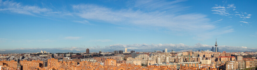 Skyline of the city of Madrid, on a day with blue sky and clouds, from the popular neighborhood of Vallecas