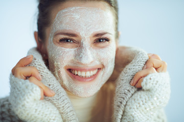 smiling woman with white facial mask covering in clothes