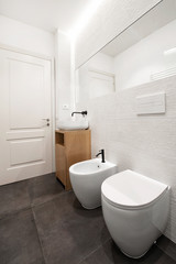 Fototapeta na wymiar White bathroom in modern apartment