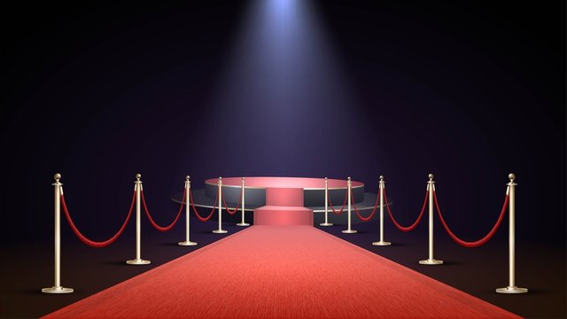 Red carpet in a dark room with spotlights and a round stage, the path to glory