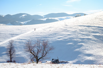 sun over the mountains with snow, Cindrel mountains, Paltinis, Romania