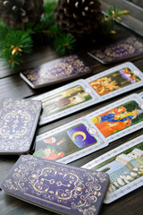 Fortune teller predicting future from tarot cards, vertical image