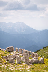 Fototapeta na wymiar Mountain Hochobir with ruin of hut and Kamnik–Savinja Alps