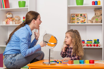 Cute little girl at speech therapist office