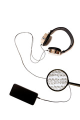 SMART PHONE AND HEADPHONES LISTENING TO MUSIC ON WHITE BACKGROUND. technology