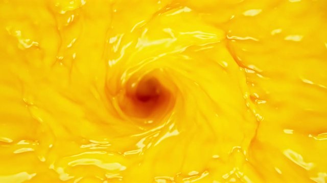 Super slow motion of orange juice in twister shape. Filmed on high speed cinema camera, 1000 fps.