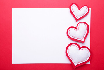 Valentines day greeting card. Handmaded hearts on red background.