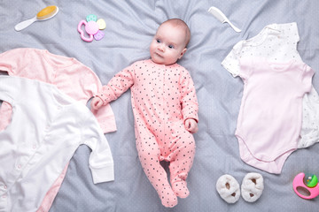 Baby on white background with clothing, toiletries, toys and health care accessories. Wish list or...