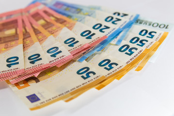 Euro banknotes isolated over white with clipping path