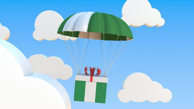 Box with national flag of Nigeria falls with a parachute. Loopable conceptual 3D animation